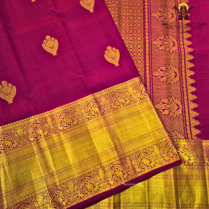 A rich Magenta / Rani Pink with Antique Gold Zari Saree