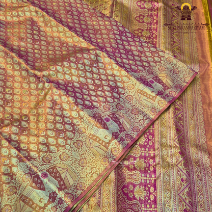 A shimmering copper-gold tissue base, giving the fabric a radiant and luxurious Saree