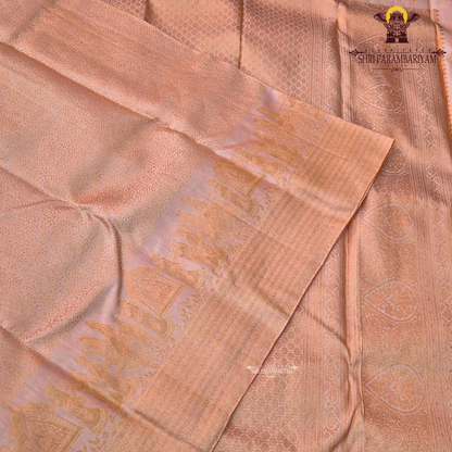A soft peachy rose (muted bridal pink) shade with a warm undertone—an elegant Saree
