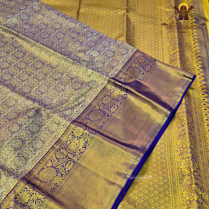 Elegant antique gold / muted gold with a rich royal blue border Saree