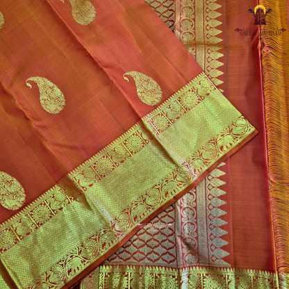 A radiant Vermilion Orange shade, beautifully highlighted with an exquisite gold zari Saree
