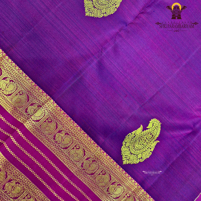 A rich dual-tone deep wine purple with magenta undertones Saree