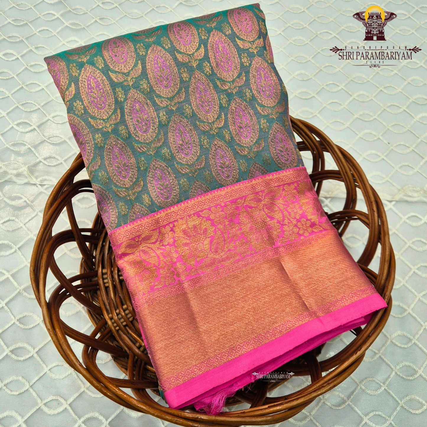 Peacock green (teal green) body with rich pink contrast border & pallu Saree