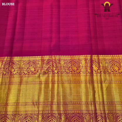 A rich Magenta / Rani Pink with Antique Gold Zari Saree