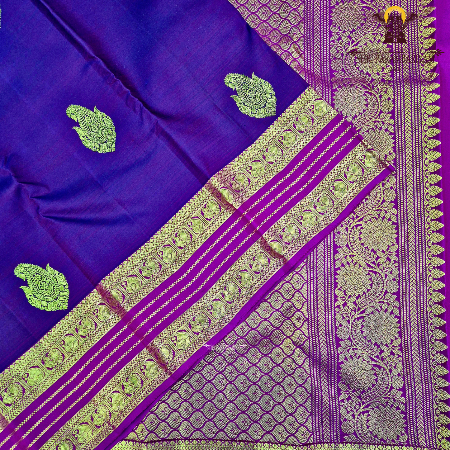 A rich dual-tone deep wine purple with magenta undertones Saree