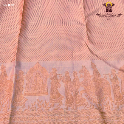 A soft peachy rose (muted bridal pink) shade with a warm undertone—an elegant Saree