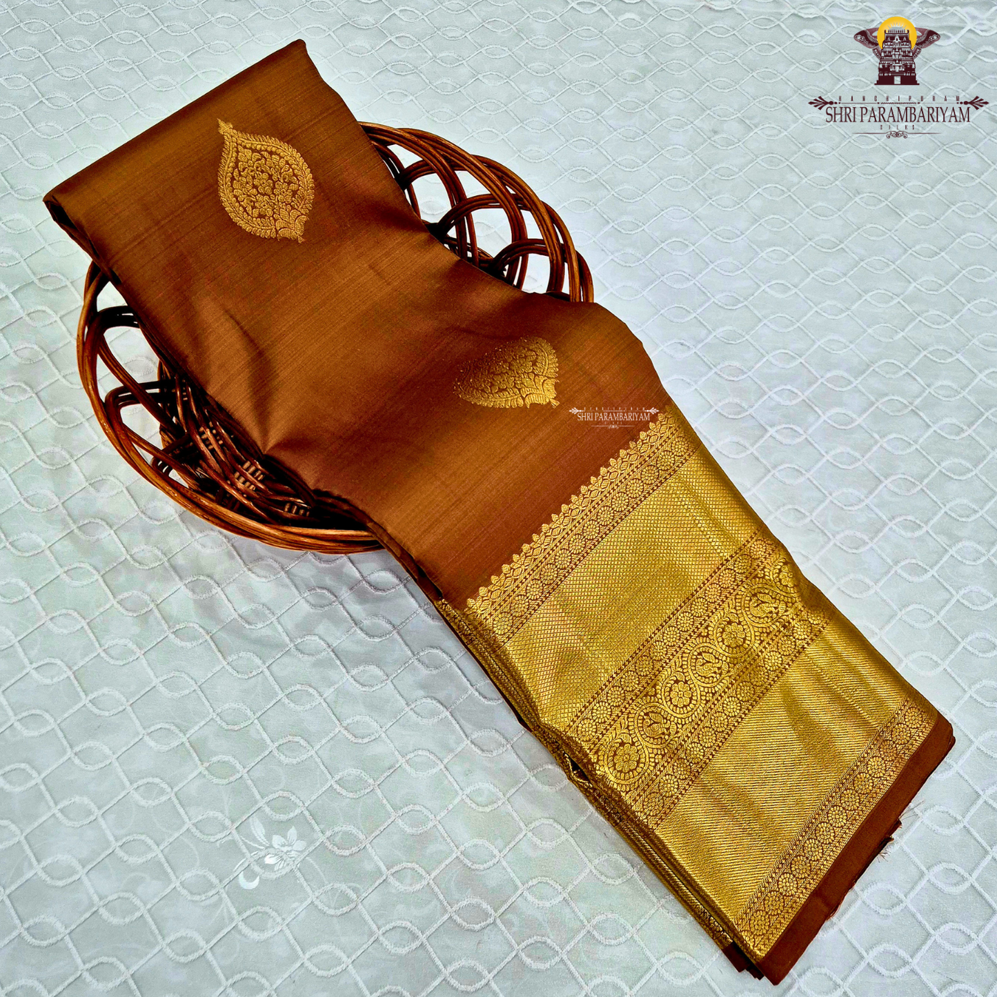 A sophisticated Antique Copper Brown / Golden Tan shade, beautifully enhanced with rich gold zari Saree