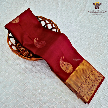 A Rich Wine Maroon with elegant Antique Gold Zari woven buttas Silk Saree