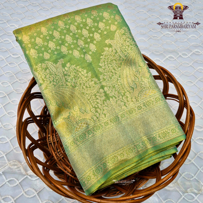 A rich parrot green shade beautifully highlighted with shimmering Saree