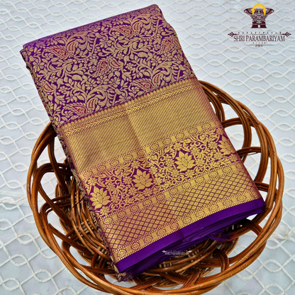 A rich magenta purple shade with luxurious antique gold zari Saree