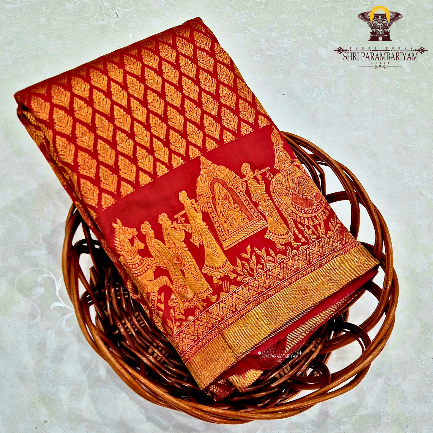 A rich and vibrant bridal red with lustrous gold zari work—classic Saree