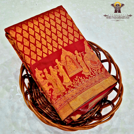 A rich and vibrant bridal red with lustrous gold zari work—classic Saree