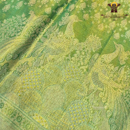 A rich parrot green shade beautifully highlighted with shimmering Saree