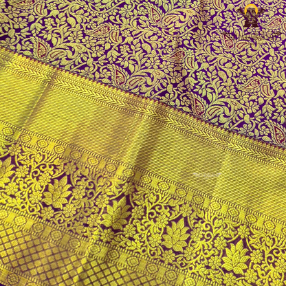A rich magenta purple shade with luxurious antique gold zari Saree