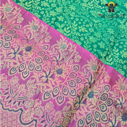 A vibrant peacock green / teal green base with elegant light gold zari work Saree