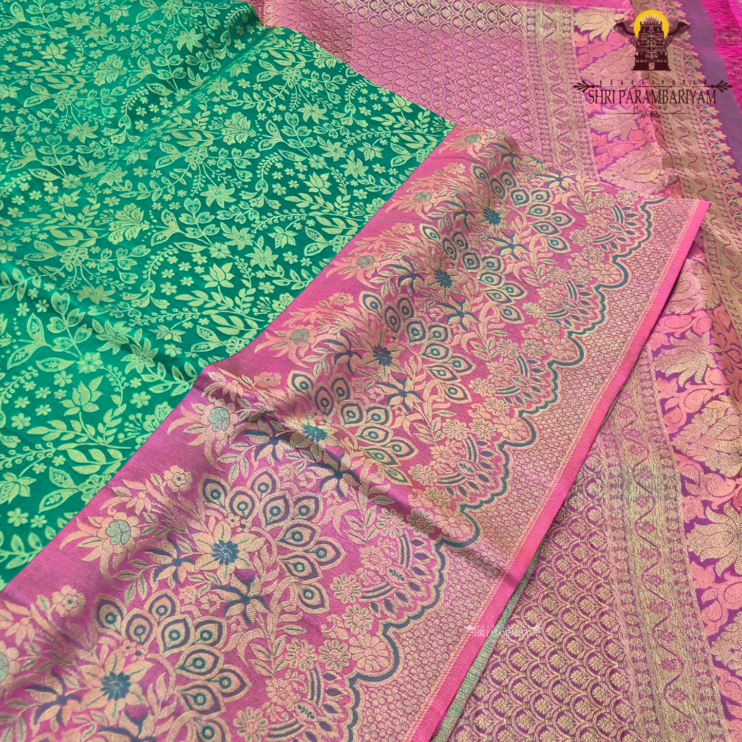 A vibrant peacock green / teal green base with elegant light gold zari work Saree