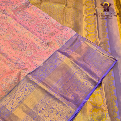 A beautiful dual-tone combination with a soft peach-pink body complemented Saree