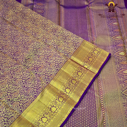 A rich magenta purple shade with luxurious antique gold zari Saree
