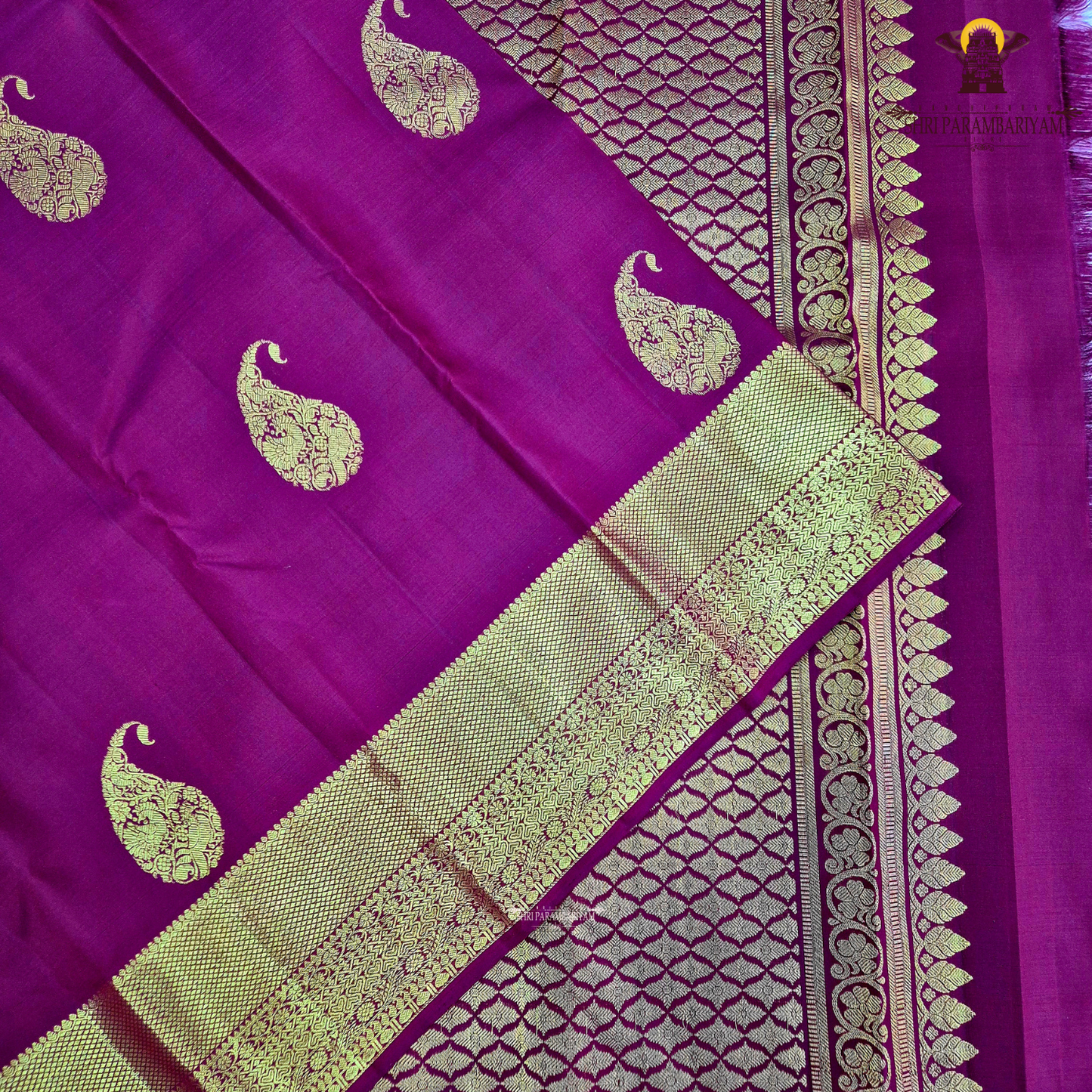 A Rich Wine Maroon with elegant Antique Gold Zari woven buttas Silk Saree