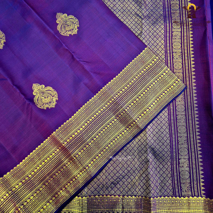A deep Magenta Purple / Rani Purple with a rich dual-tone Saree