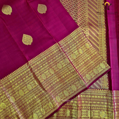 A rich Deep Maroon Red with exquisite gold zari weaving Saree