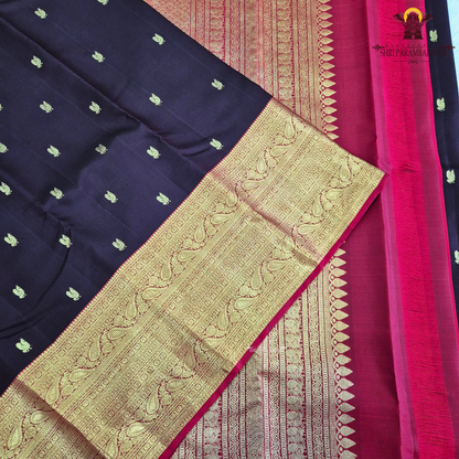 A luxurious deep black grape shade, adorned with delicate gold zari Saree