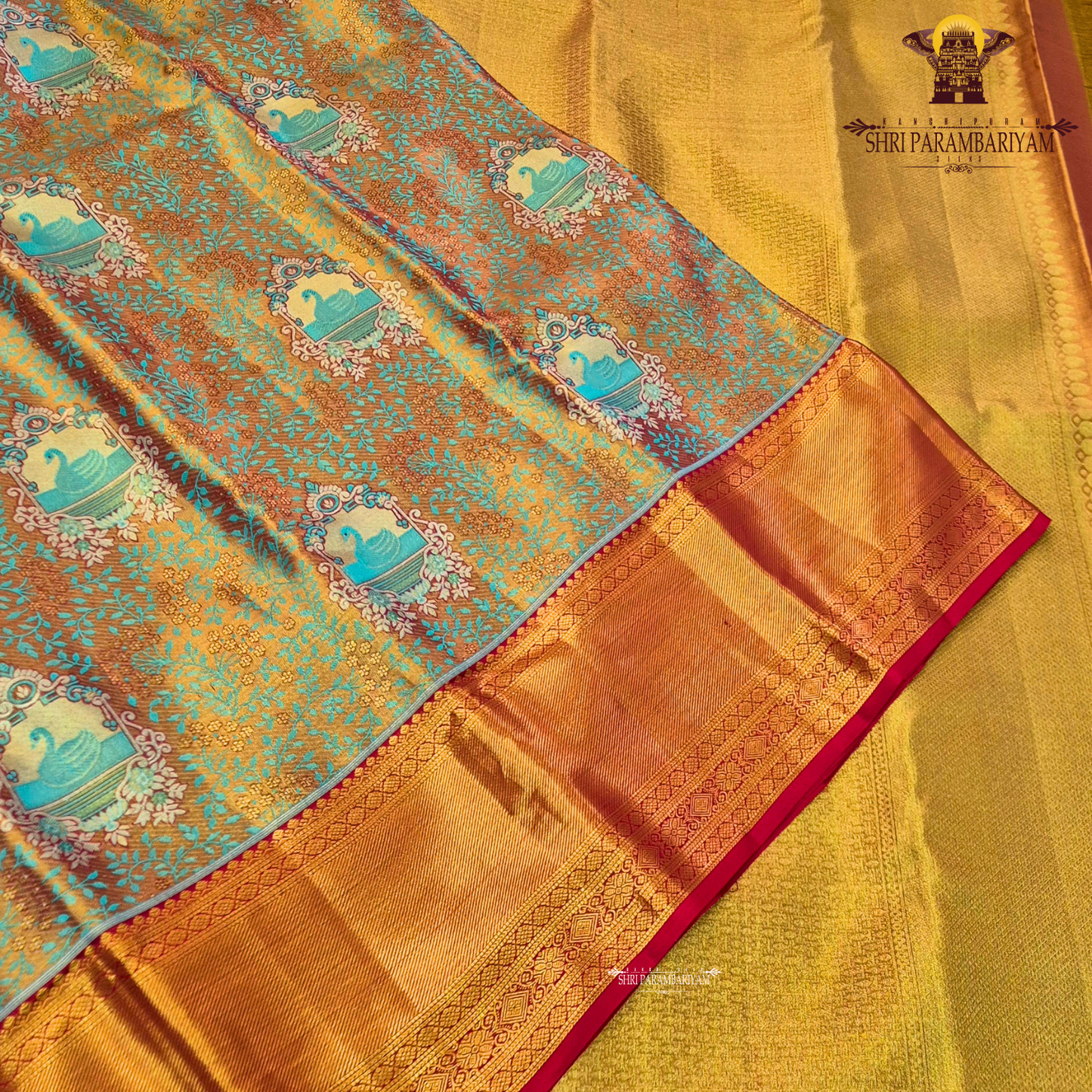 Rich dual-tone blend of antique gold and teal green Saree