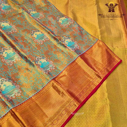 Rich dual-tone blend of antique gold and teal green Saree