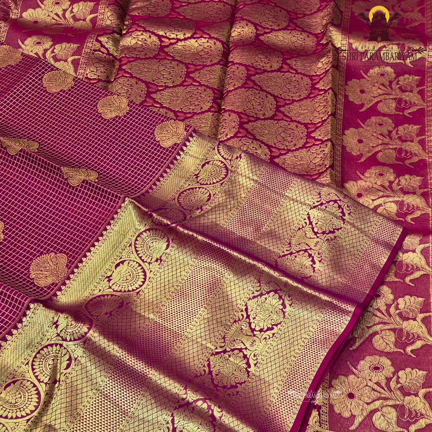 A rich and regal deep magenta / rani pink base adorned with opulent antique gold zari work Saree
