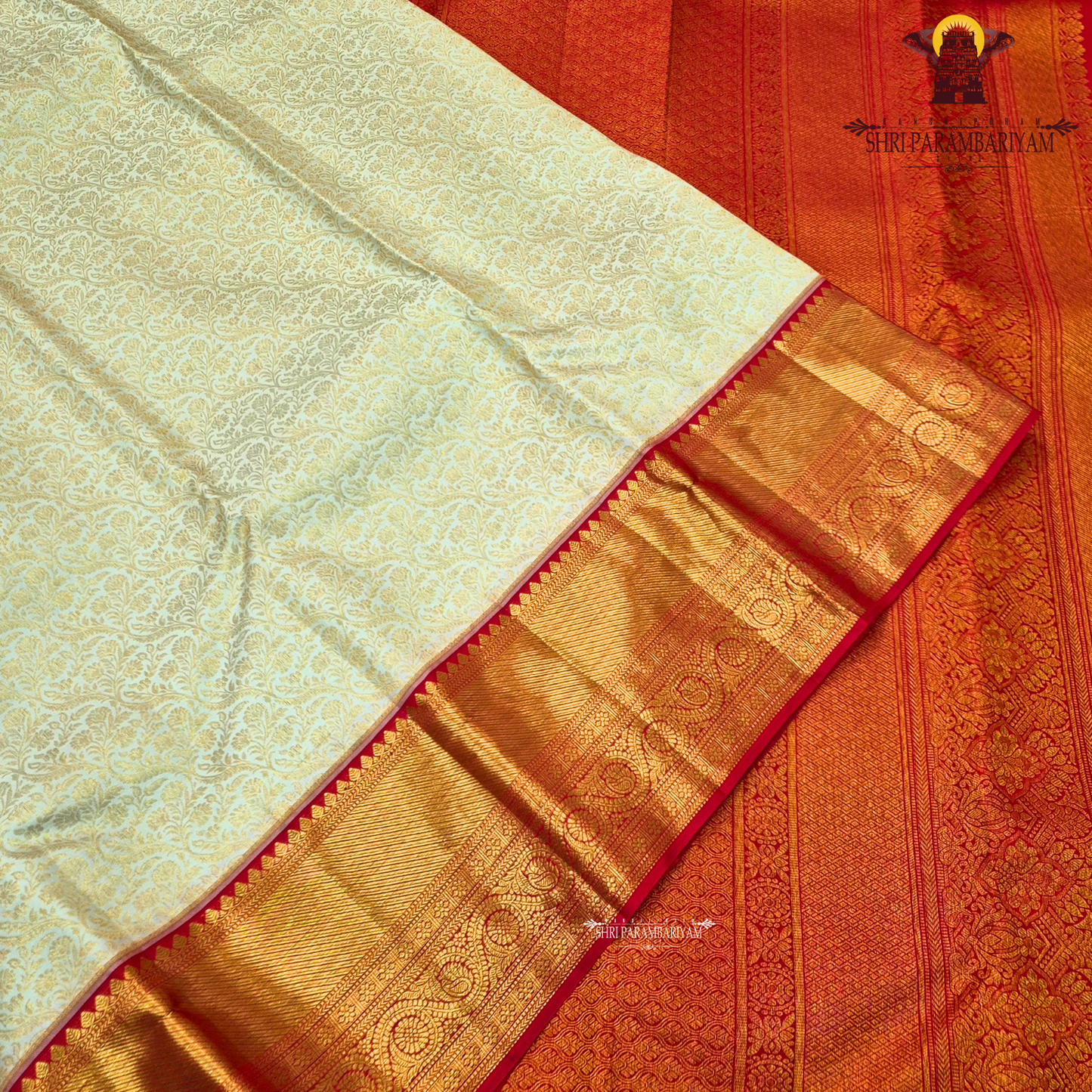 Elegant half white (off-white/ivory) body paired with a rich contrast red border Saree