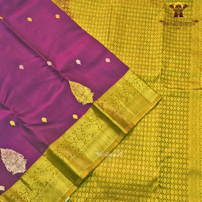 Rich royal purple (magenta-violet tone) with a contrasting antique gold zari border Saree