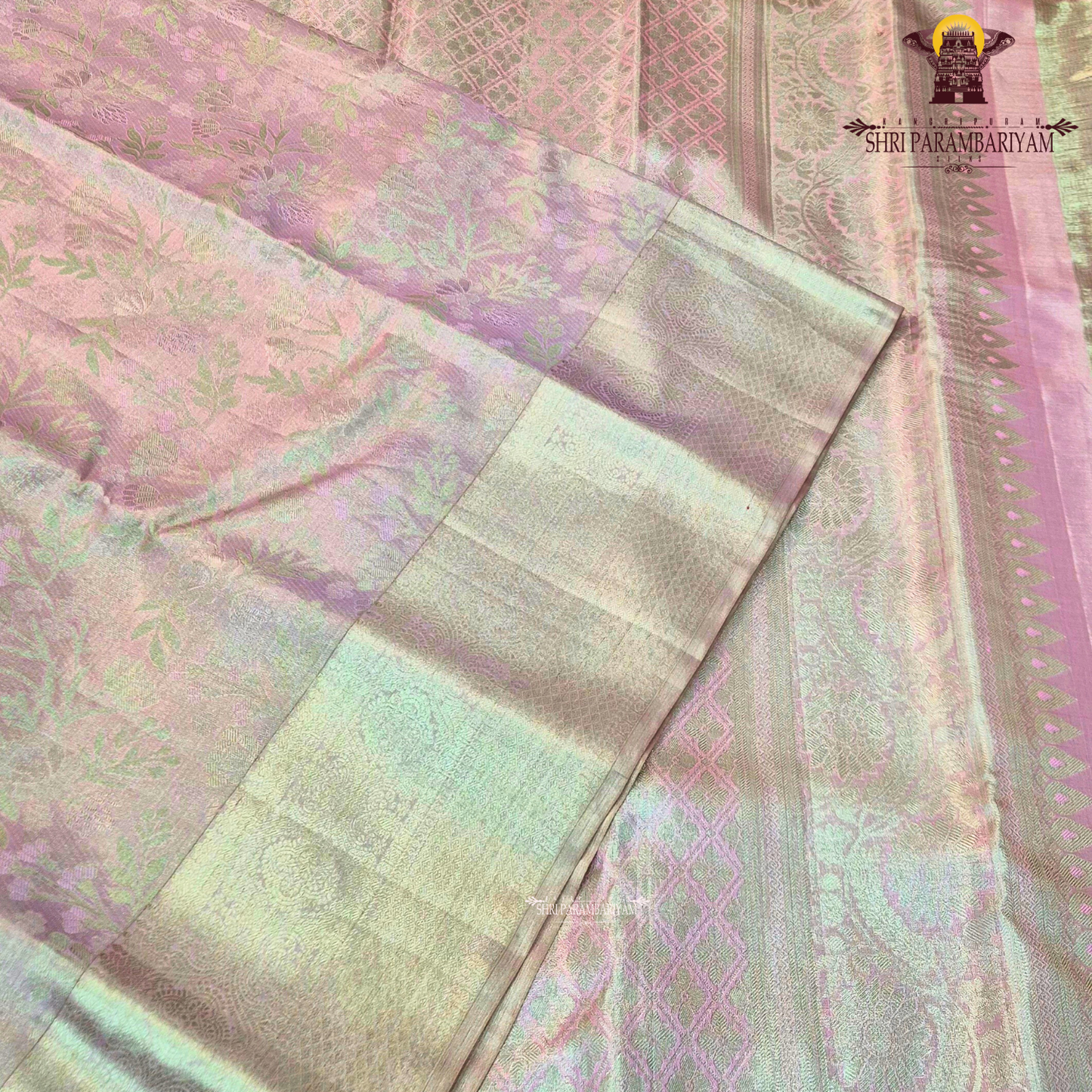 A graceful baby pink shade blended with soft golden tissue Saree