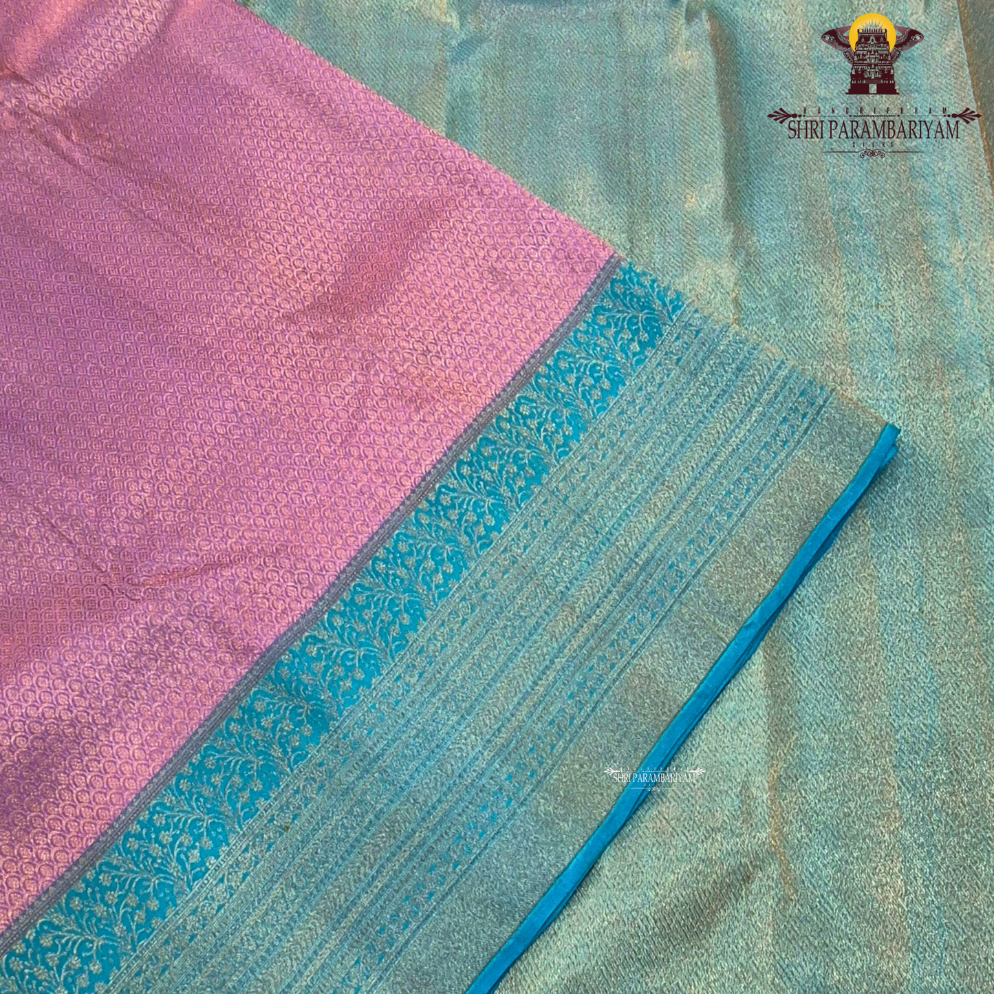 A beautiful combination of lavender (light purple) body with a contrasting turquoise blue (peacock blue) Saree