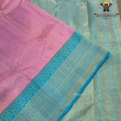 A beautiful combination of lavender (light purple) body with a contrasting turquoise blue (peacock blue) Saree