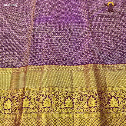 A rich magenta purple shade with luxurious antique gold zari Saree