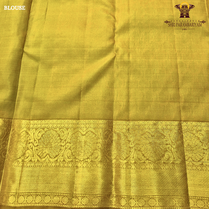 Rich teal green (peacock green tone) with a contrast gold zari border featuring a parrot green shade Saree