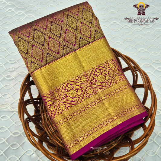Rich rani pink (magenta) base with an opulent antique gold zari weave Saree