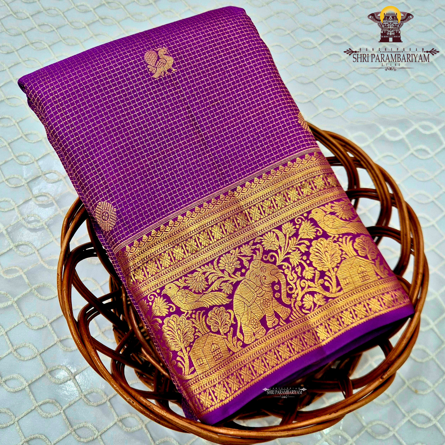 Vibrant royal purple shade, beautifully accentuated with gold zari Saree