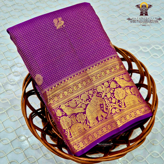 Vibrant royal purple shade, beautifully accentuated with gold zari Saree