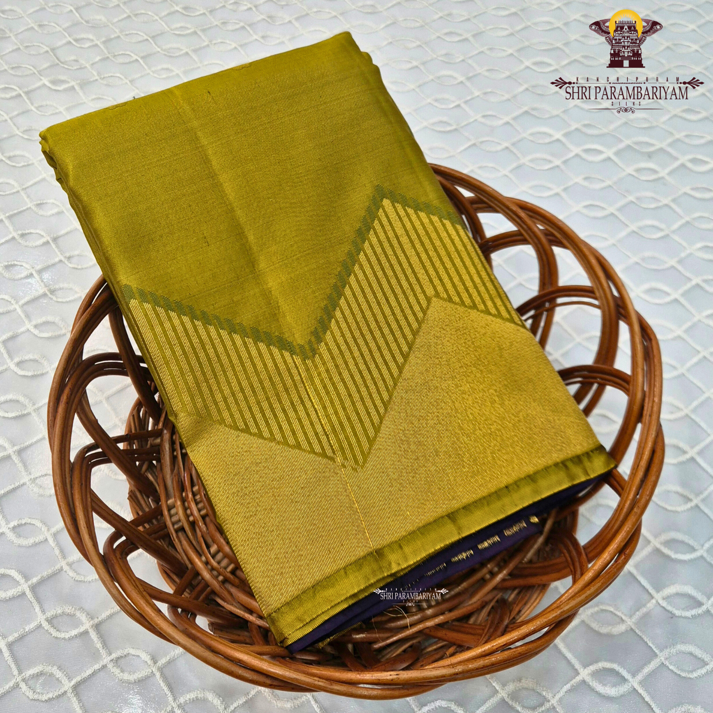 A sophisticated smoky taupe (greyish-brown) Saree