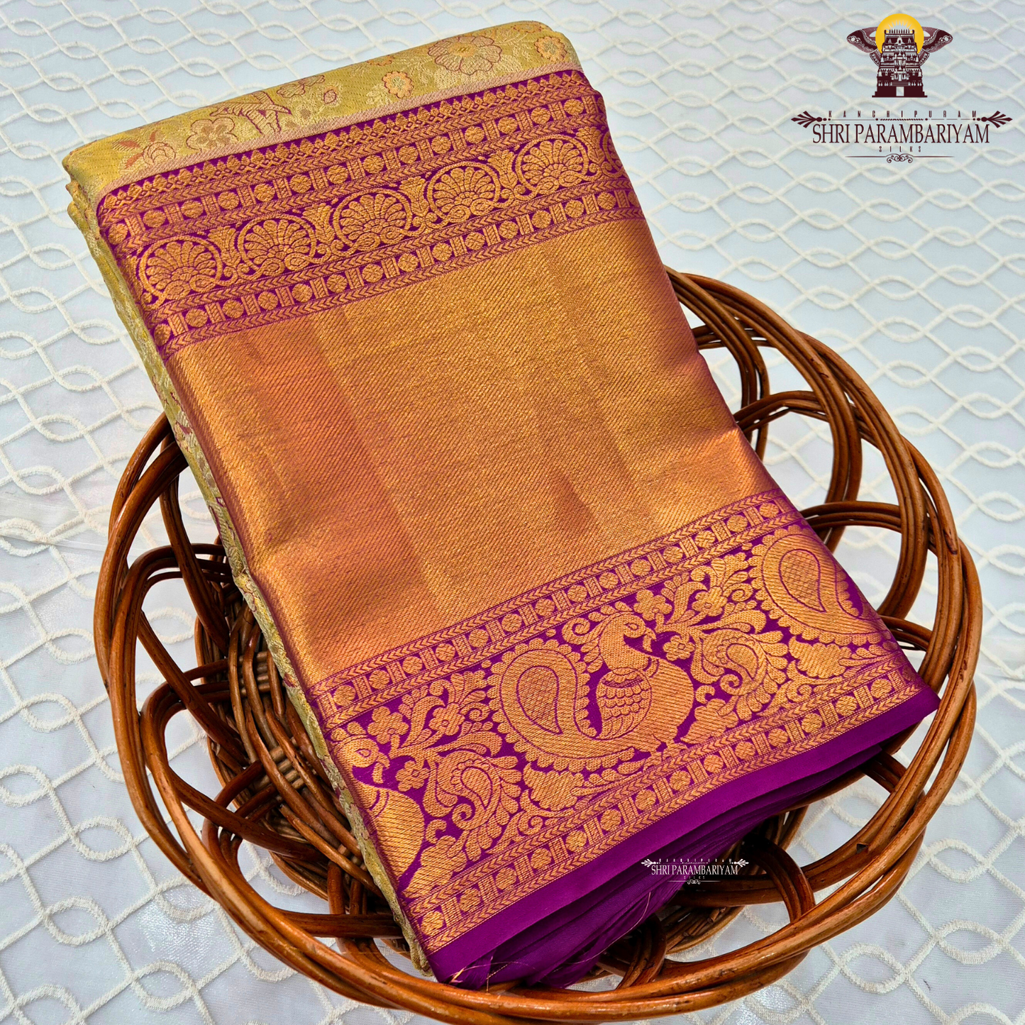 Rich antique gold/copper-toned tissue body paired with a vibrant deep magenta border Saree