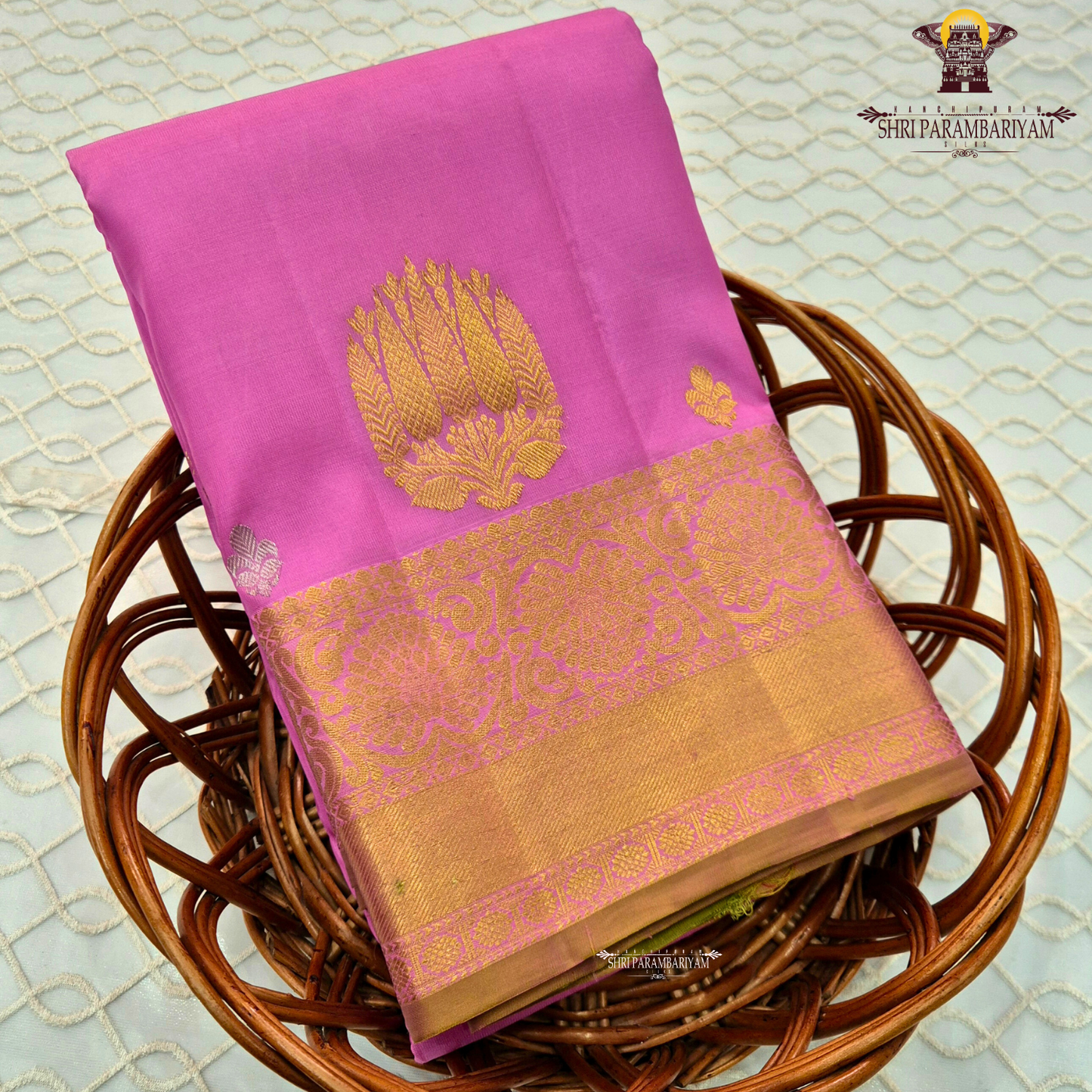 Elegant rose pink (lotus pink shade) with a rich gold zari border Saree