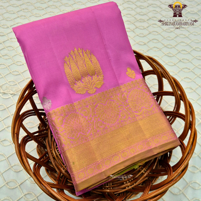 Elegant rose pink (lotus pink shade) with a rich gold zari border Saree