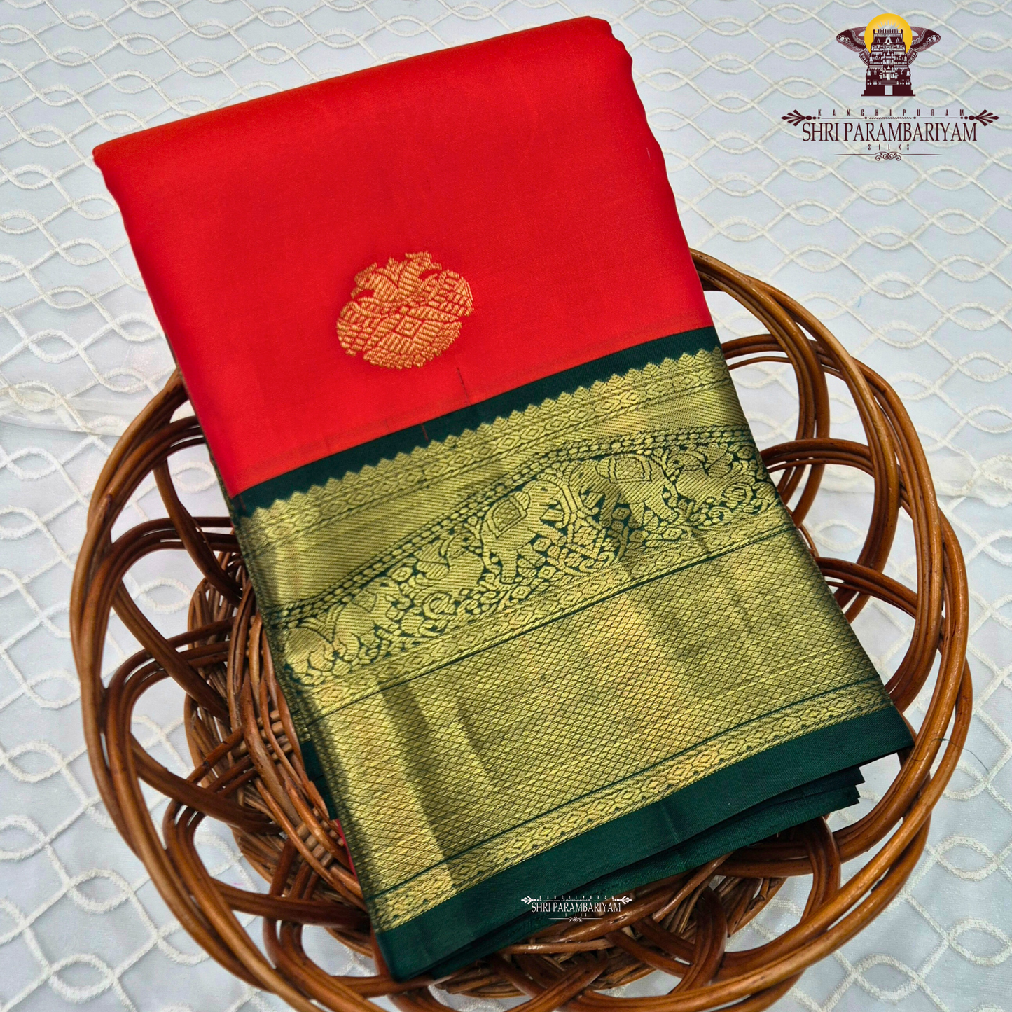 Bright Vermilion Red body with a deep Bottle Green border Saree