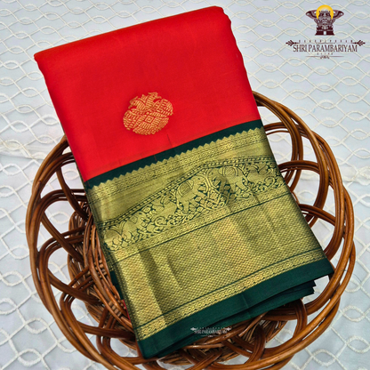 Bright Vermilion Red body with a deep Bottle Green border Saree