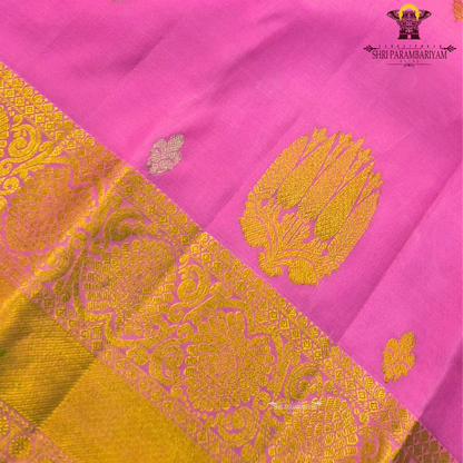 Elegant rose pink (lotus pink shade) with a rich gold zari border Saree