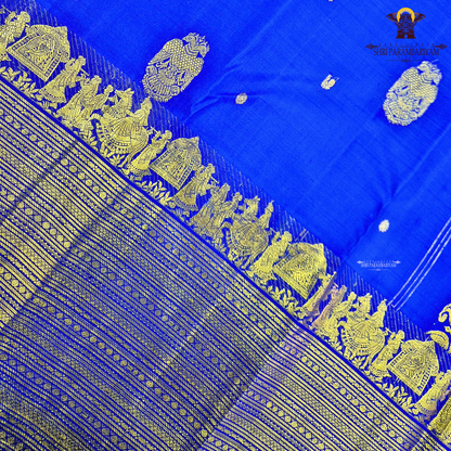 A vibrant royal blue body adorned with elegant gold zari Saree