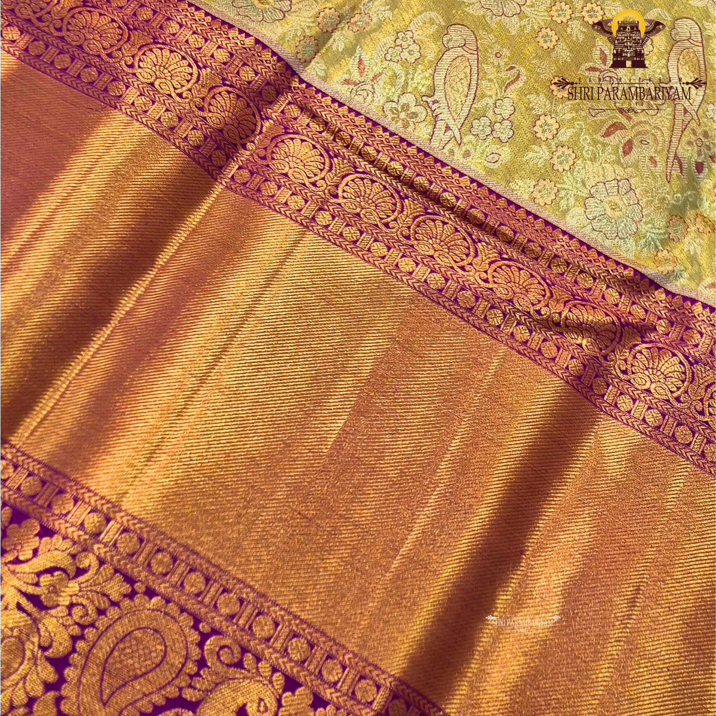 Rich antique gold/copper-toned tissue body paired with a vibrant deep magenta border Saree