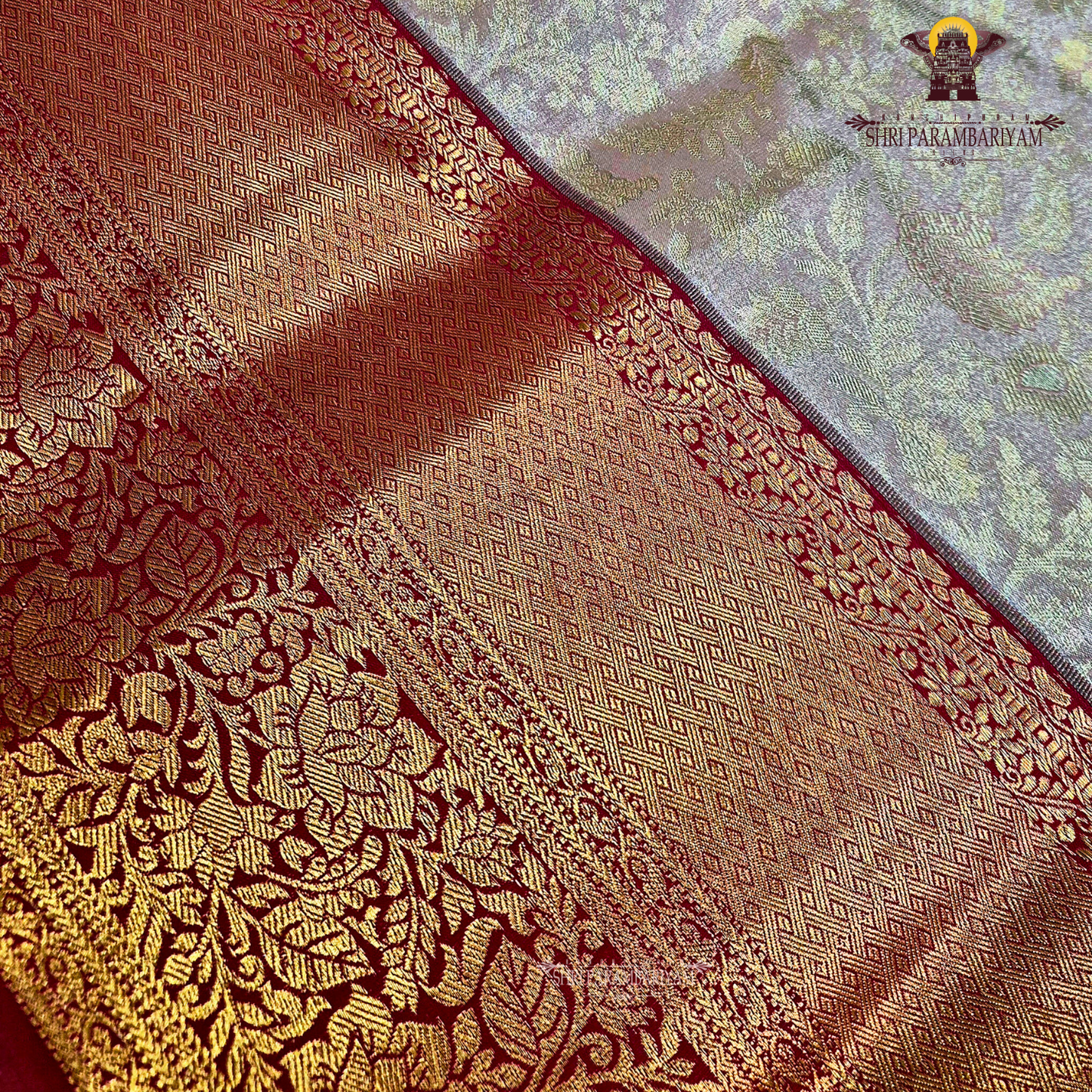 Classic champagne gold body paired with a rich brick red border Saree