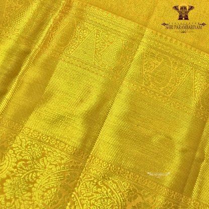 A vibrant turmeric yellow shade Saree